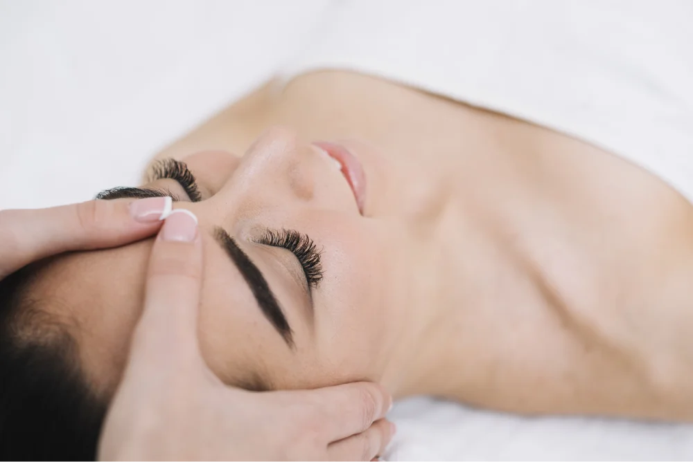 woman receiving relaxing facial massage